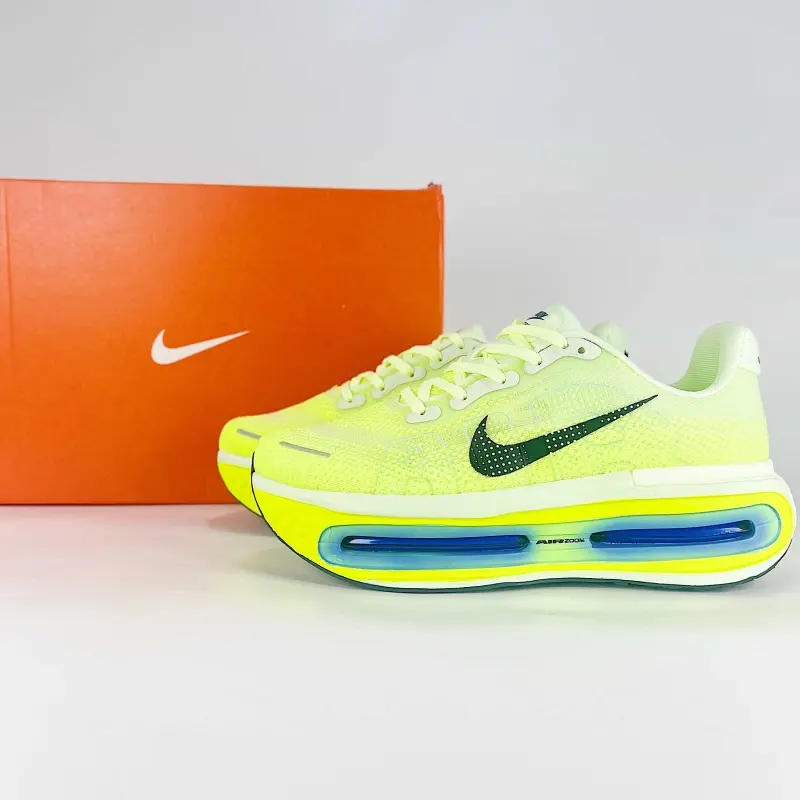 Lightweight low‑cut athletic trainers, bright lime woven upper, cushioned footbed, lace‑up build for outdoor walking casual styling
