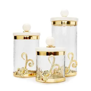 Glass Canister w/Gold Lotus Flower Décor & Marble Lid Glass Canister w/Gold Lotus Flower Décor & Marble Lid