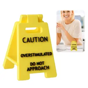 Caution Overstimulated Desk Sign Signage, Yellow Sign with Black Text, Humor Gag Gift for Coworkers, Boss & Employees, Mini Novelty Desk Decor, Office Desktop Decorations, Office Home Decor