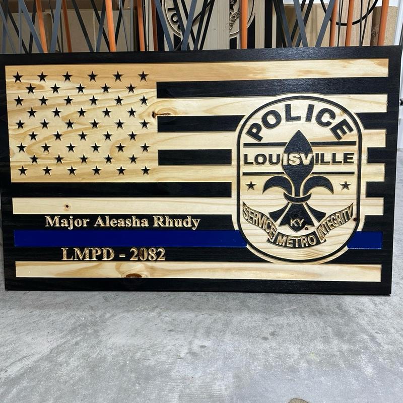 Custom engraved wooden American flags for police, firefighters, veterans or active duty military make great decor and hangable.