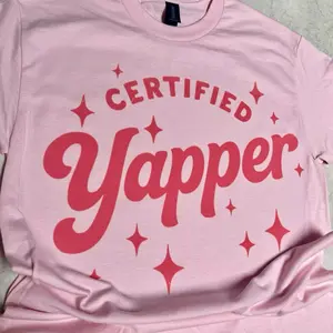 Certified Yapper Pink T-Shirt with Bold Red Lettering and Sparkle Design for Fun and Stylish Wear