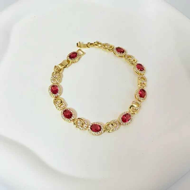 Cod 7041 Bracelet 7.5 Inches Long with Red Stones and Gold Design