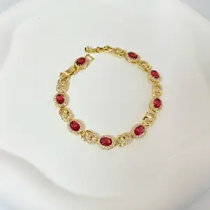 Cod 7041 Bracelet 7.5 Inches Long with Red Stones and Gold Design