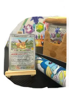 Pokemon Prismatic Evolutions Collection Exclusive Eevee 074/131, Playmat, Pouch, and Poster