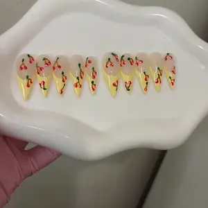 Yellow acrylic french tips with cherrys