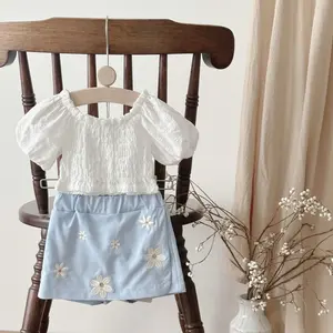 Two-Piece Summer Baby Outfit — White Puff-Sleeve Top + Blue Loose Skirt Pants with Floral Embroidery for Infants & Toddlers