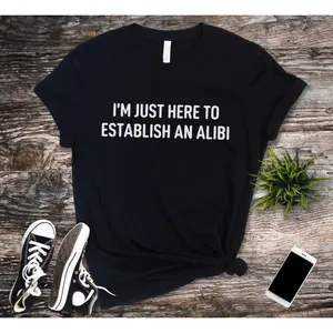 Women's funny and witty statement Graphic T-Shirt - Short Sleeve Crew Neck Regular Fit Casual Wear | Soft & Breathable Fabric, Durable Print, Everyday Comfort, Machine Washable, casual and humorous flat lay with accessories on wooden background