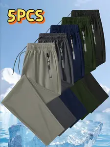 Set of 5 men’s ice silk jogging pants featuring breathable, mid-stretch fabric, an elastic waistband design, zippered pockets, nylon fabric—ideal for fitness enthusiasts and suitable for outdoor sports in summer. fit gym lightweight men wholesale boy