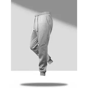 Men's Jogger Pants with Elastic Ankle Cuffs, Simple Casual Style, Drawstring Waistband Design, Embroidered Accents on Side, Relaxed Fit, Suitable for Comfort-Seeking Individuals, Perfect for Daily Homewear and Outings.