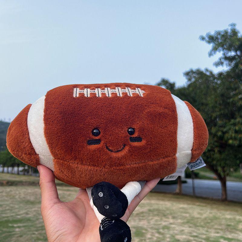 Soccer Ball Plush Rugby Football Cute Smiling Face Embroidered Feet Soft Cuddly Huggable Buddy Game Decoration Throw Pillow Kids Birthday Christmas Gift