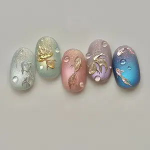 Short oval colorful translucent cat eye nails with blue and green little fish, champagne gold fine iridescent glitter and flowing drip gel, fresh summer style, gradient ombre, cute and playful removable false nail tips with jelly glue and nail file