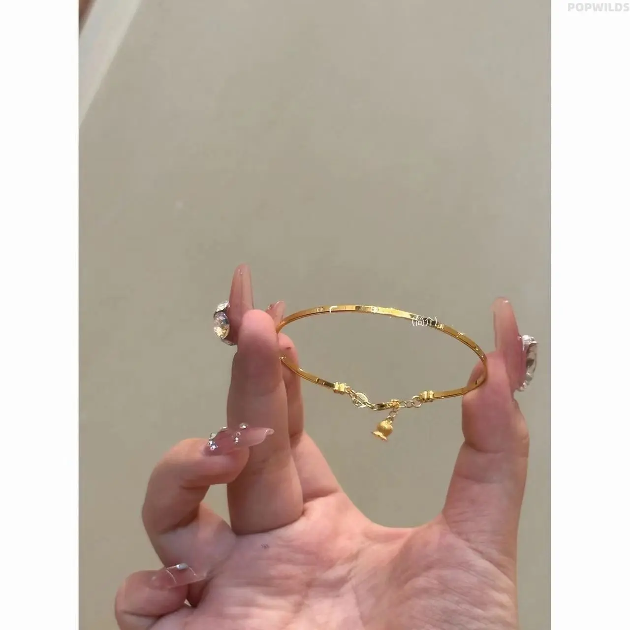 Golden bell orchid bracelet for women. Exquisite niche design, full of elegant charm. This light luxury jewelry is a tasteful daily accessory for ladies.