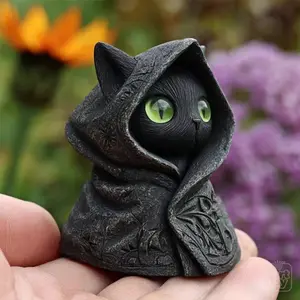 Gothic Black Cat Statue  with Emerald Eyes & Hooded Cloak - A Mysteriously Crafted Mini Resin Figurine, Perfect for Halloween, Witchy Decor, or Cat Lovers. This Hand-Painted Collectible Features Expressive Green Eyes and A Detailed Cloak