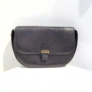 Pre-owned Hermes Hermès Vintage Black and Gold Ostrich Leather Saddle Bag Classic Design with Gold Accents