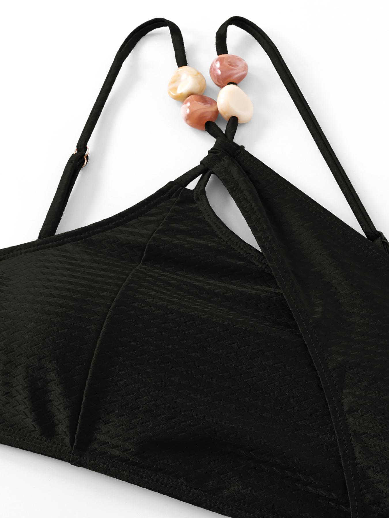 New European/American two-piece bikini swimsuit for women — sexy design with soft padding; three-piece set including a beach skirt, ideal for hot springs vacations.