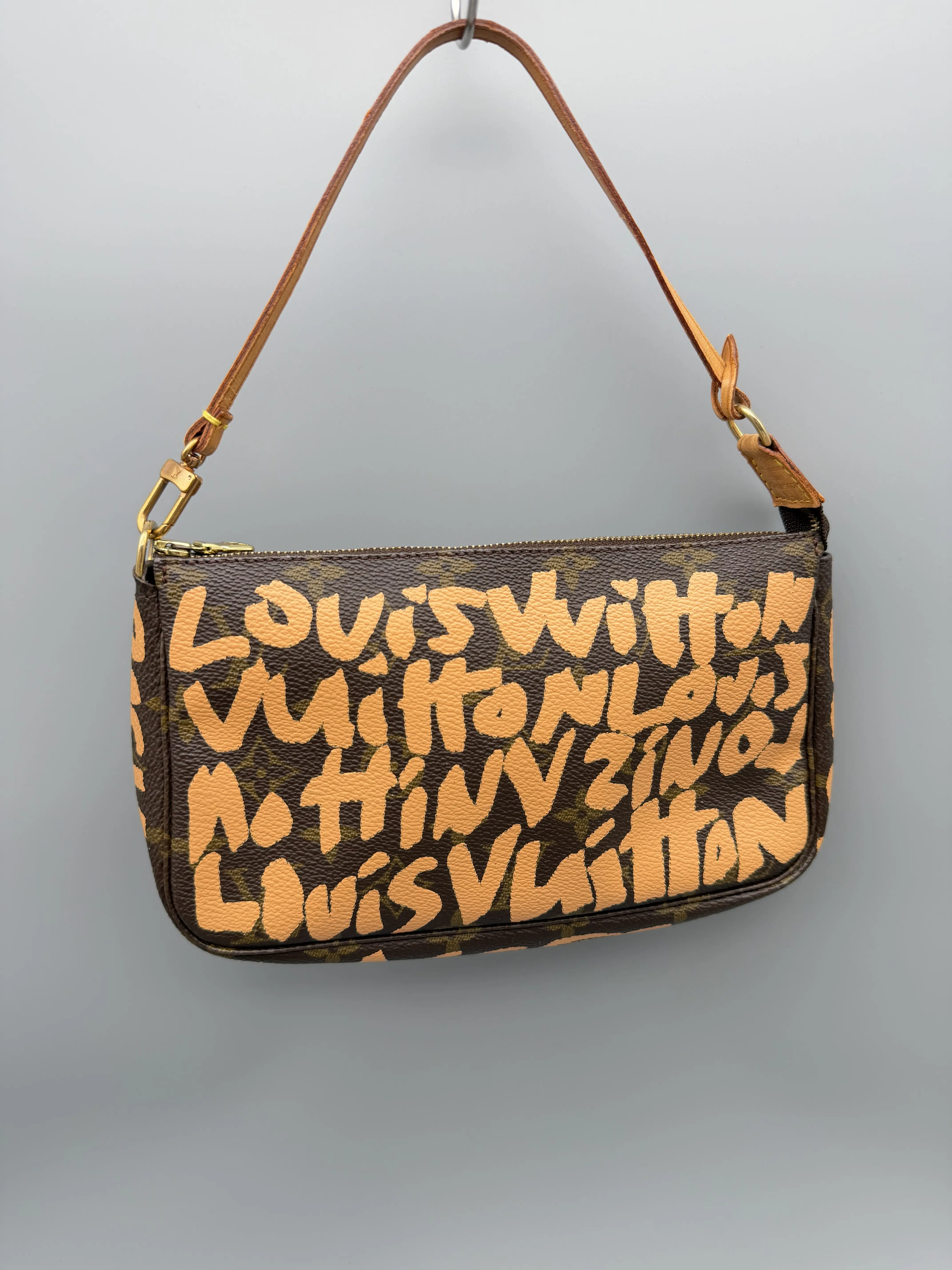 Pre-owned Louis Vuitton Coated Canvas Mini Bags x Stephen Sprouse Graffiti Pochette Accessories Coated Monogram Canvas Mini Bag, Zip, Limited Edition Luxury Handbag Collection, Gold Tone Hardware, Honey Patina on Vachetta Strap