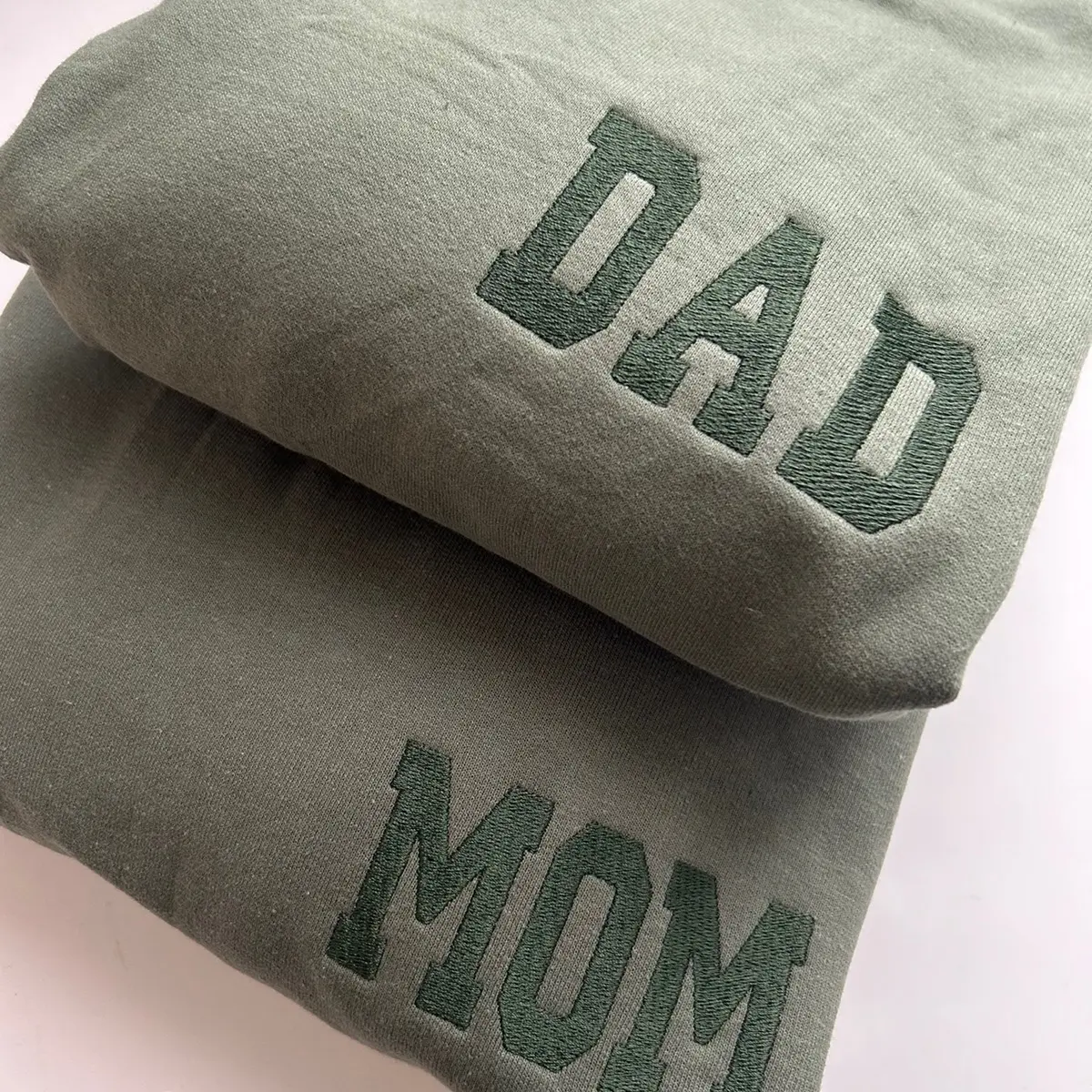 Embroidered left chest monochromatic dad mom sweatshirt. Matching couple crewneck.