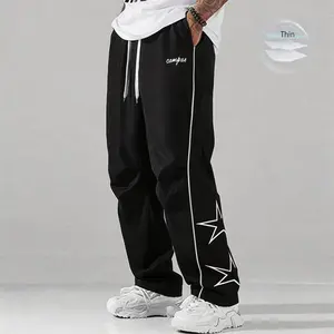 Summer loose men’s sports pants, long length, lightweight soft fabric, plus-size fit, gray side stripes with gold decorative stripes, comfortable design, casual athletic pants, fitness wear, 100% polyester, SpringStatements
