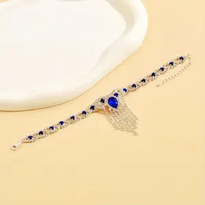 Fashionable shiny tassels paired with blue rhinestone anklets, perfect for women's birthday parties, engagement parties, and wedding parties, as well as luxurious and dazzling jewelry accessories