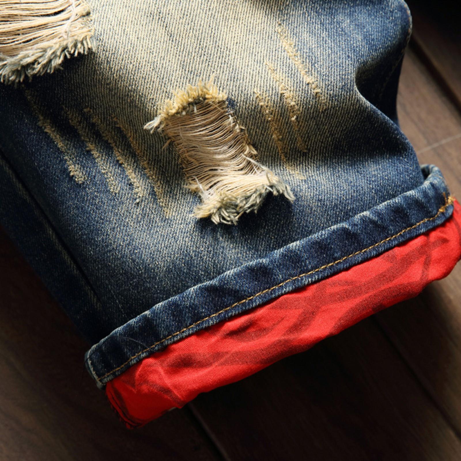 Bleached distressed denim mid-rise shorts with no stretch, multiple rips, raw hem, red-edge print lining—trendy five-inch inseam