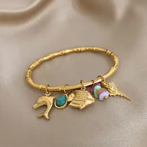 Ocean Charm Bracelet for Women, 18K Gold Plated Bamboo Bangle with Dolphin, Shell & Fish Pendants, Boho Beach Mermaidcore Jewelry for Summer Vacation Gift