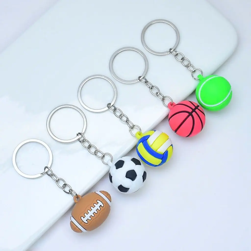Mini sports ball keychains available in various designs: soccer, tennis, basketball, and American football.