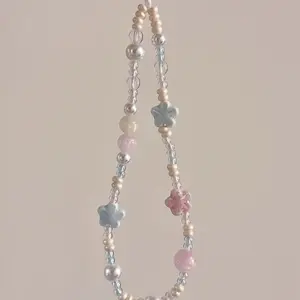 Instagram-style macaron flower phone lanyard, women's niche design ceramic flower CCD camera wrist strap anti-lost bracelet Phone Charm, Phone Accessories, Phone Chain, Phone Decoration