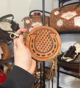 Tooled leather horseshoe round coin pouch Tooled leather horseshoe round coin pouch