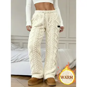 Unisex winter fleece-lined pants, textured fabric, drawstring waist, comfortable warmth, outdoor and home wear, ideal for cold weather, casual lounge pants, casual fashion pants