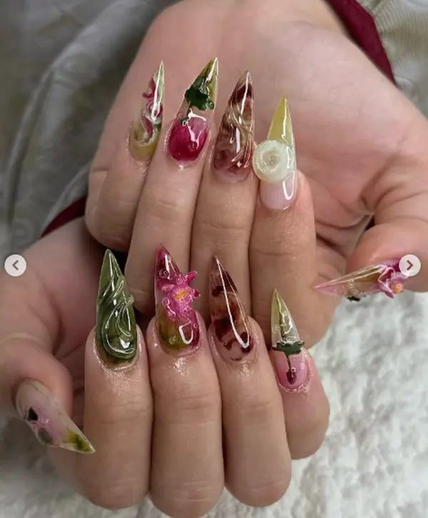 Enchanted garden stiletto nails, encapsulated flowers & leaves design. Natural 3D floral art. Perfect for spring
