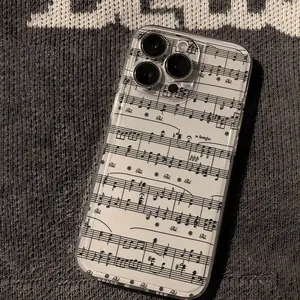 This transparent, minimalist, stylish, and creatively designed drop-proof phone case features a letter and musical note pattern. It's suitable for iPhone XR, 11, 12, 13, 14, 15 Plus, 16 Pro Max, and 17 Air models.