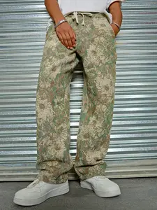 One men’s straight-leg casual pants featuring an oil painting floral jacquard design, urban relaxed style, elastic waistband with drawstring, paired with all-over oil painting floral jacquard. Smooth fabric drapes comfortably. Suitable for urban men’s eve