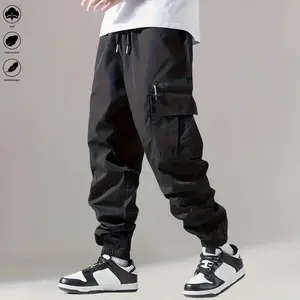 Men’s cargo pants with an elastic waistband and adjustable drawstring; men’s jogger pants—a perfect choice. Simple, casual design with multiple pockets. Comfortable pants for outdoor wear and running/sports, ideal for casual wear.