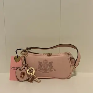 Juicy Couture Royal Convertible Baguette Wristlet - Pink Clay Mini Bag for Casual Outings.