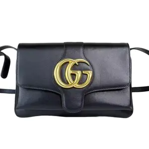 Pre-owned GUCCI Leather Crossbody Bags Black Arli Crossbody Bag with Gold GG Logo and Adjustable Strap for Everyday Use