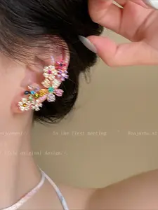 A pair of dopamine color-matching flower ear studs for women, featuring a luxurious and high-end, niche design that fits the ear bone.