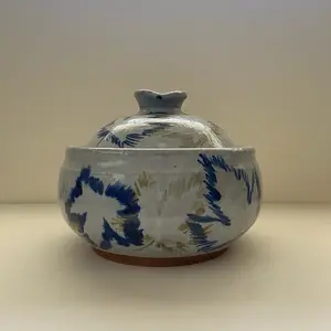 Ceramic crock with painted leaves