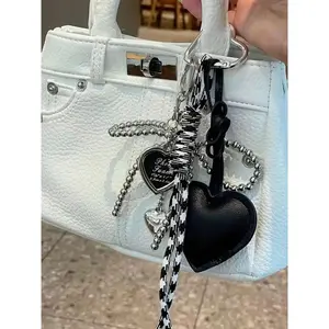 A Niche, Personalized, And Refined Ambiance Pendant Featuring Bow And Heart Design Elements, With Braided Lanyard Decoration For Easy Portability. Versatile In Use, Suitable As A Bag Pendant Or Keychain, Ideal For Commuting And Shopping