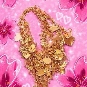 Junky Freestyle Charm Bracelet with Assorted Charms and gold Tone Chain for Fashion Accessories
