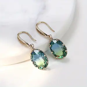 High-end, luxurious and elegant fashion ladies' oval blue gemstone pendant earrings with a sophisticated and grand copper jewelry design. Fashionable women's gifts suitable for various occasions. Beautiful holiday gifts.
