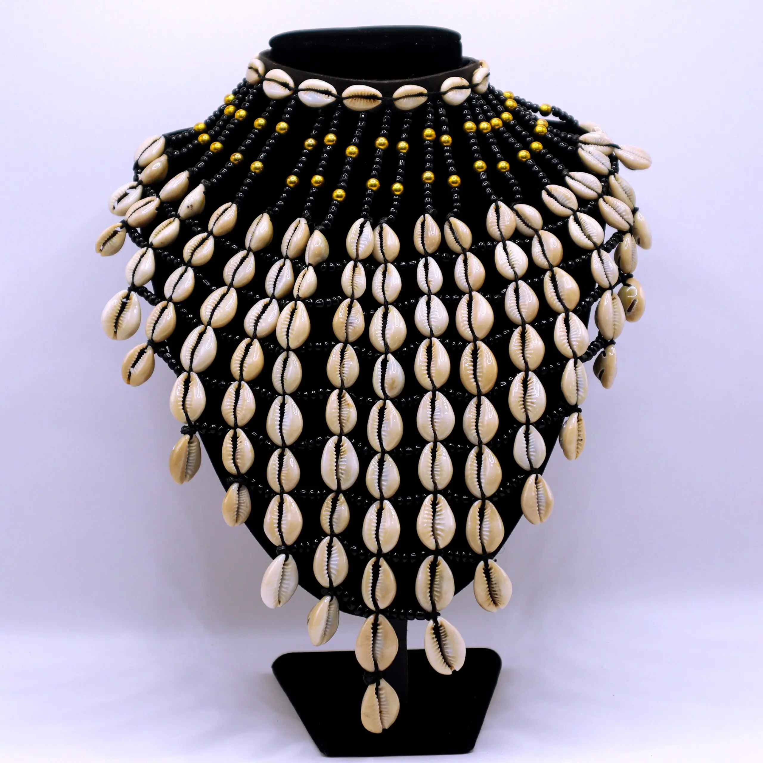 African inspired cowrie shells fringe neckpiece.