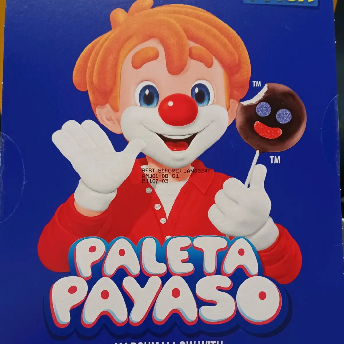 "Paleta Payaso" or "Clown Lollipop" is part of the great variety of candies that the mexican brand Ricolino manages. This lollipop is made with a soft, fluffy, sweet and spongy marshamallow and it's surface is covered with a thin