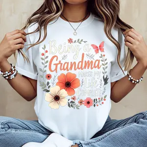 Being A Grandma Makes My Life Complete Floral Butterfly Print T Shirt Black Casual Loose Fit Tee For Women Perfect For Everyday Wear And Leisure Activities