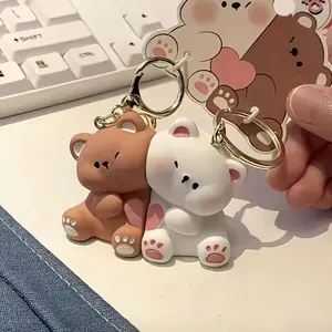 A pair of cute cartoon bear couple magnetic keychains with heart pendant - brown and white bear, durable silicone material, the perfect gift for your beloved on Valentine's Day