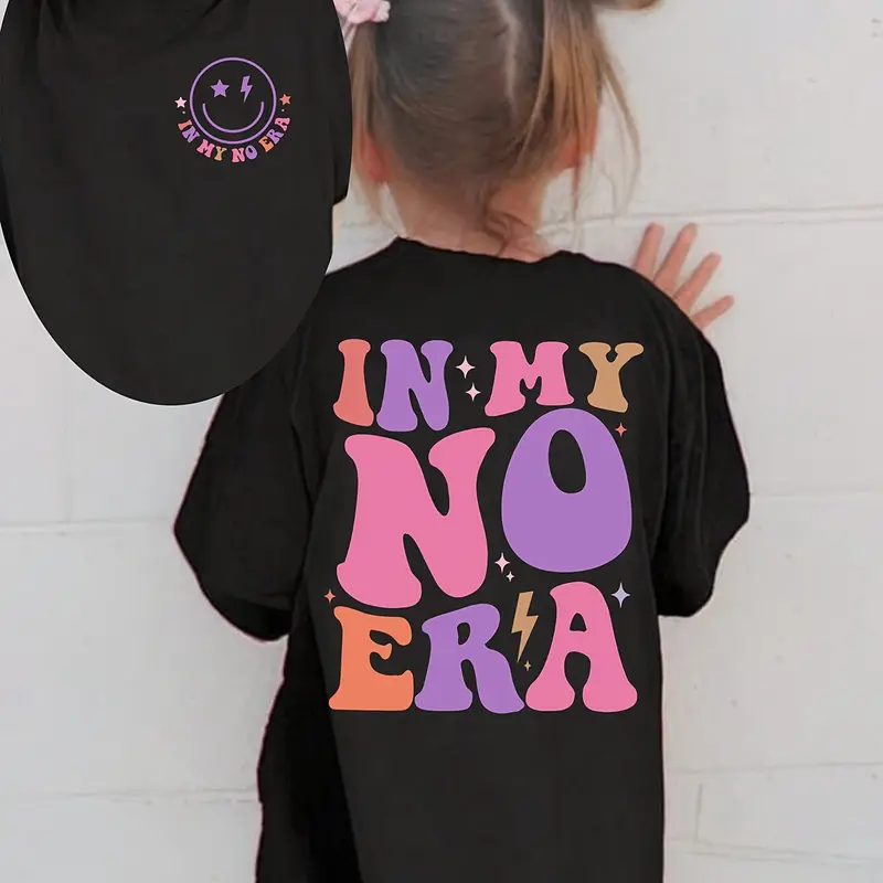PUEMCO Girls' Comfy Cotton Short-Sleeve Graphic Tee - 70s Retro Vibe, Bold 70s Print, "In My No Era" Lettering, Mini Smiley Face, Double Stitching, Breathable Kids' Everyday Tee, Cute Basic Tshirt, Casual Top