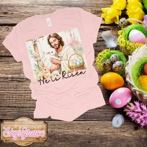 SkyGrace Easter T-Shirt - He is Risen Design with Jesus Bunny and Eggs - Soft Pink Tee for Women