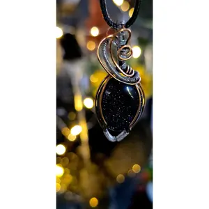 The Blues – Handcrafted Blue Sandstone Pendant with Copper & Steel Weave