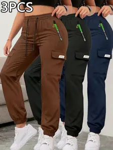 Women’s cargo jogger pants with zippered pockets for spring/summer, available in 1-pack or 3-pack. Featuring a fashionable large pocket design and an elastic waistband with an elastic drawstring waist, these are slim-fit long pants suitable for casual out