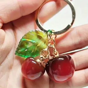 1 Cherry Keychain with Translucent Green Leaf and Red Fruit Charm - Golden Ring Clasp, Suitable for Backpacks, Wallets, Handbags - Women's Portable Keychain Accessory - Mother's Day Gift, Keychain Decoration, Novel Keychain, Nature-Inspired Design