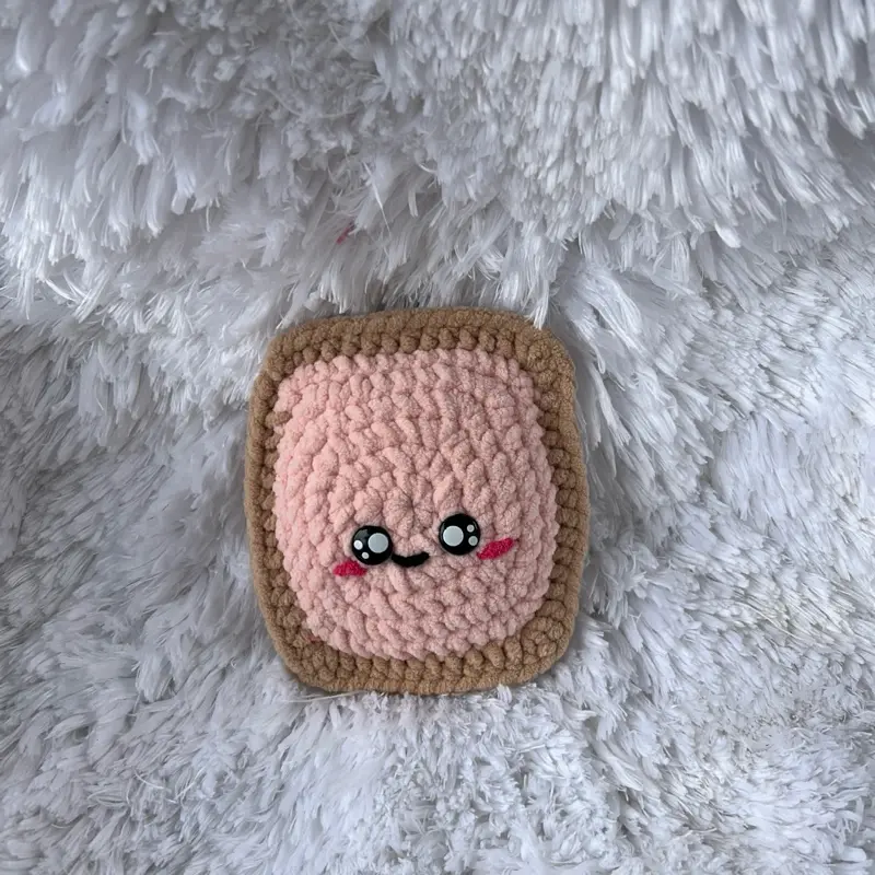 Handmade Crochet Pink Plush Poptart with Adorable Face Design Soft and Cozy Plushie Toy